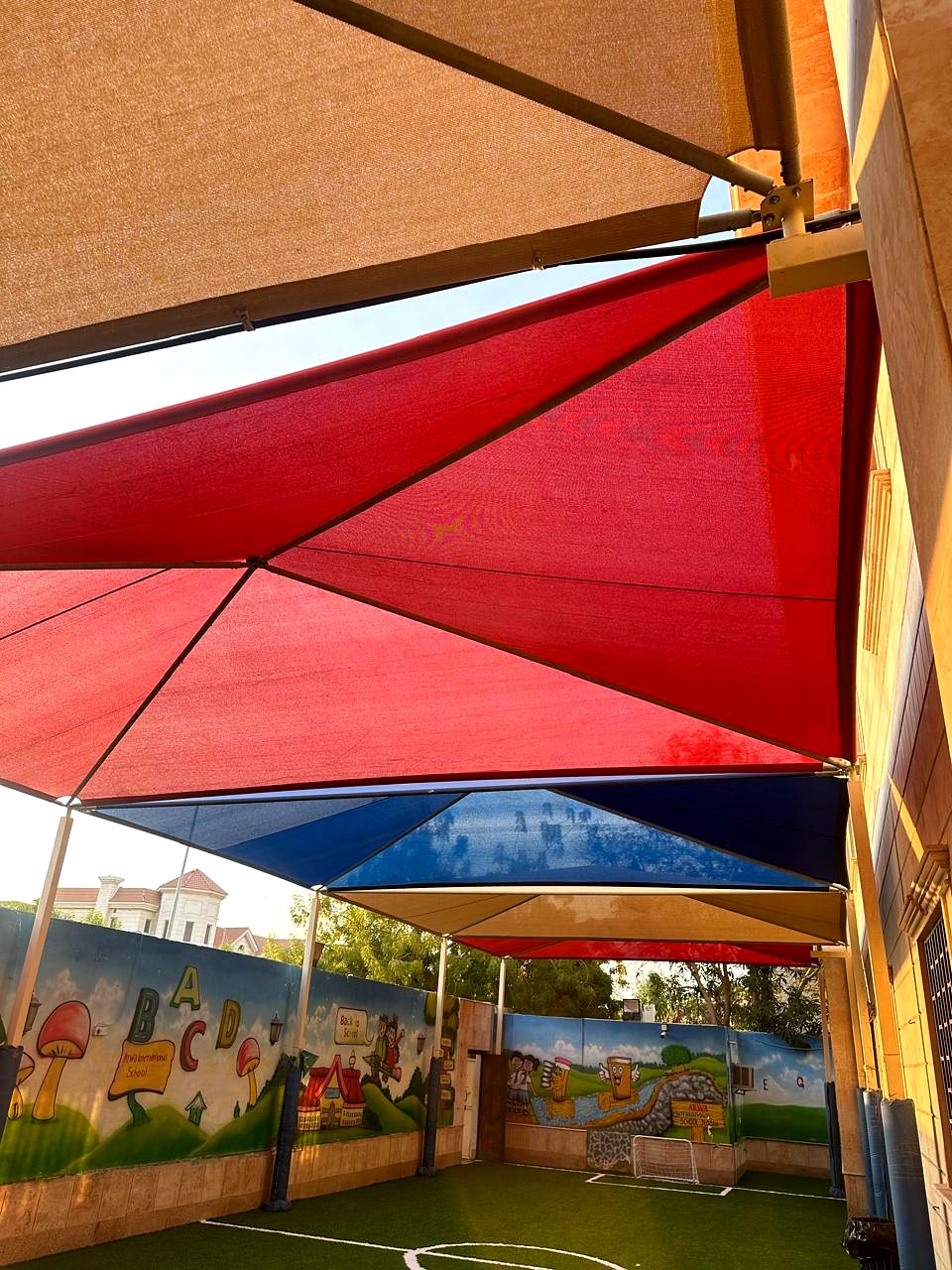 Colourful shade canopies above the ARWA outdoor court